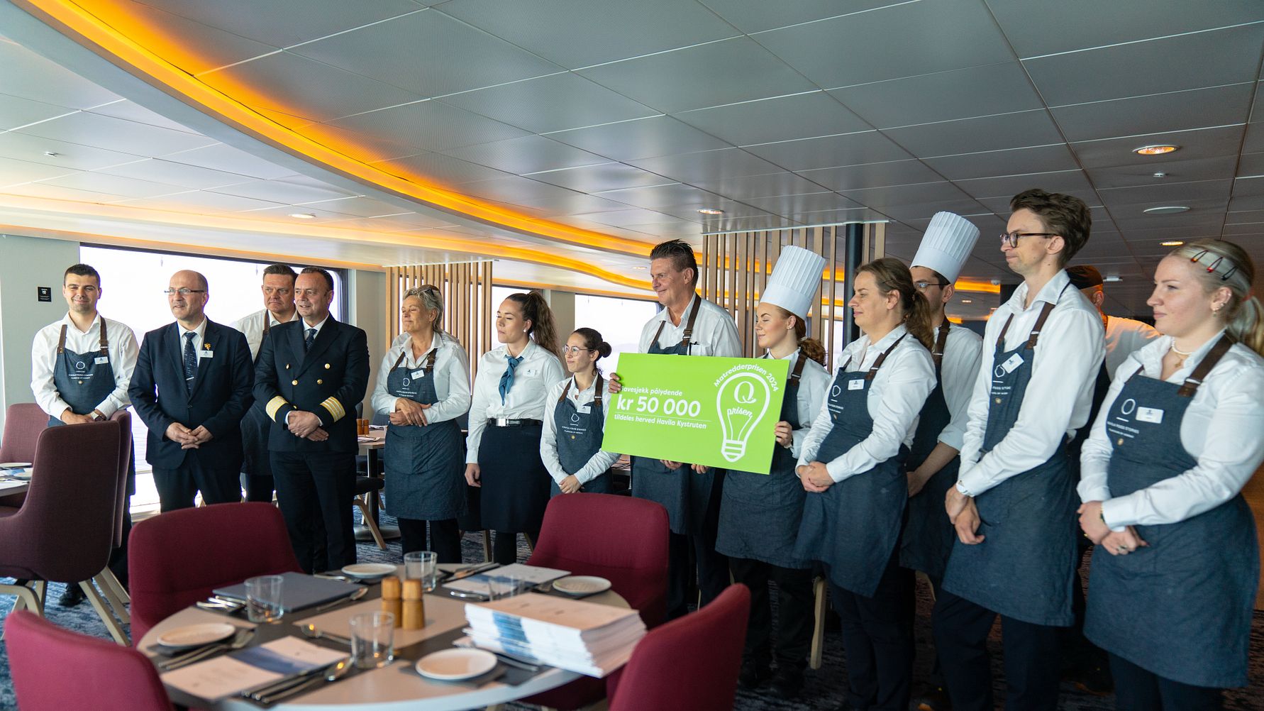 The crew on board Havila Capella received the Food Saver of the Year 2024 Award on behalf of the company. (Photo: Martin Giskegjerde/Oclin) (Image at LateCruiseNews.com - May 2024)