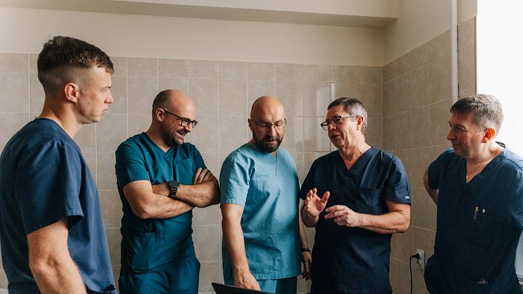 Doctor Rickard Brånemark, second from the right, prepares his team for an operation.