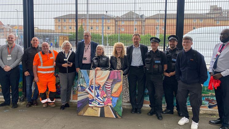 Rail industry partners and Samaritans with one of the fifteen new mural panels installed at Luton station