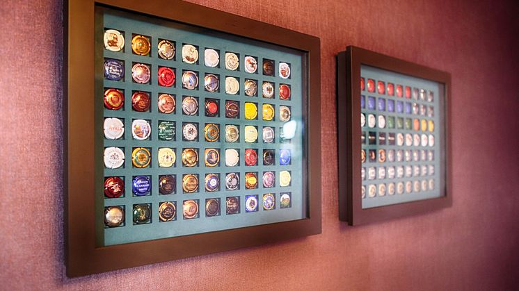 Champagne bottle top collection at Spedition Hotel, Thun, Switzerland, hotel design by Stylt Trampoli.JPG