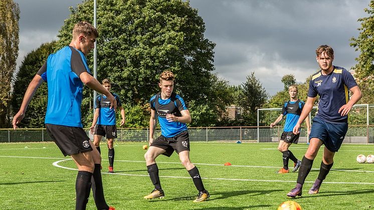 On the ball: Callum Stead (second right) trains with his colleagues in the Hatters’ youth team 