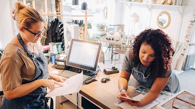 businesswomen checking shop papers SME.jpg