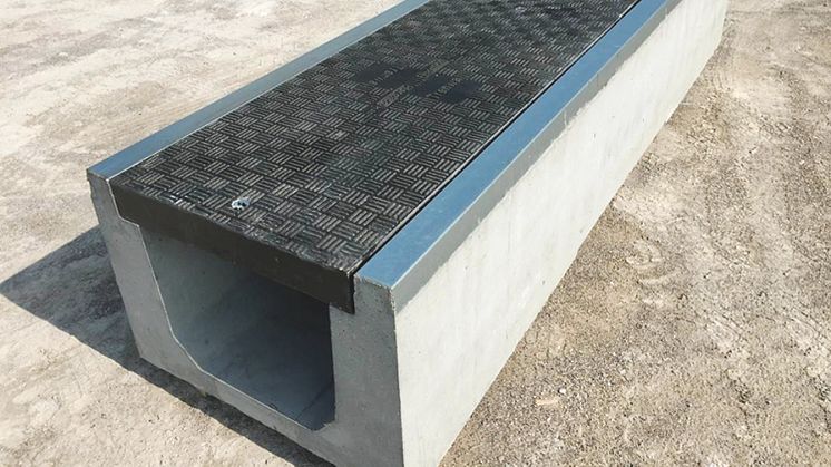 Fibrelite and Trenwa’s partnership product: heavy duty precast concrete trenches topped with light strong composite covers