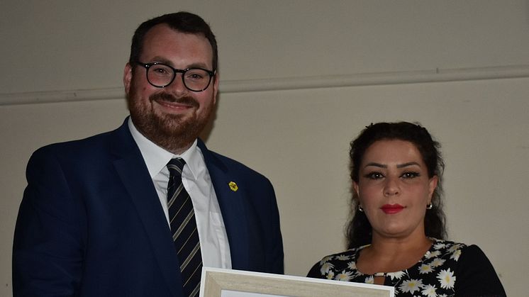 Councillor Eamonn O'Brien, the Leader of Bury Council presents the Adult Learner of the year award to Sara Saeedi