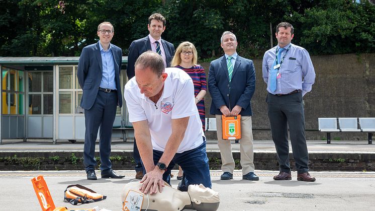 Steve Morris demonstrates heart restarter at Lewes station