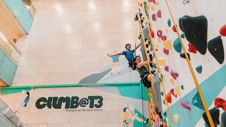 Two climbers scale the 8-metre-high High Wall at Climb@T3, which opens 4 March 2023