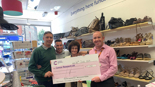 Selhurst Repair Shop colleagues Jon Dye, Tom Mills and Justin Lanigan with Jackie Lawrie, manager of Beckenham's Cancer Research shop