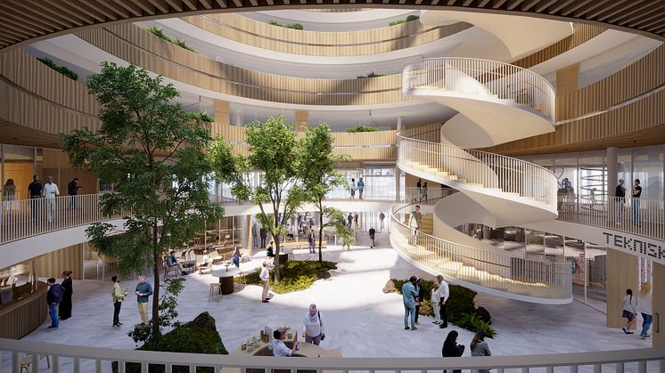 Våningsplanen öppnas mot ett atrium i mitten som inkluderar en spiraltrappa. Bild: 3XN Architects