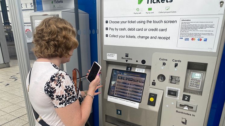 Linn Davies is guided to a ticket machine at Brighton station using the Aira app