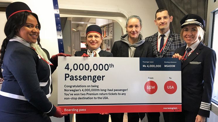 Norwegian's lucky passenger at LGW with crew members and pilot