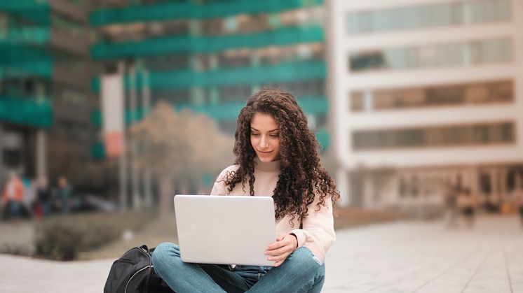 woman-in-pink-sweater-using-laptop-3764402