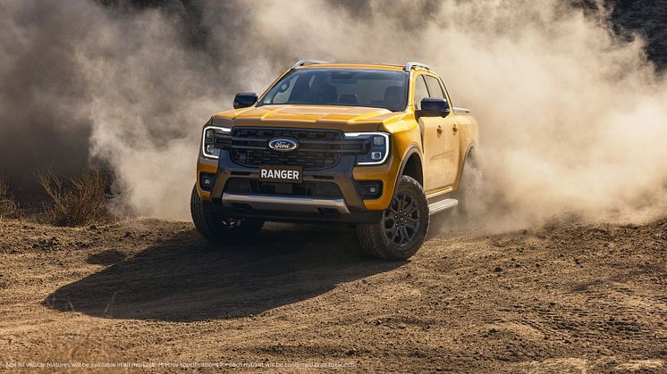 2022Ford_NextGenRanger_Wildtrak_Front3QTR_motion_sand