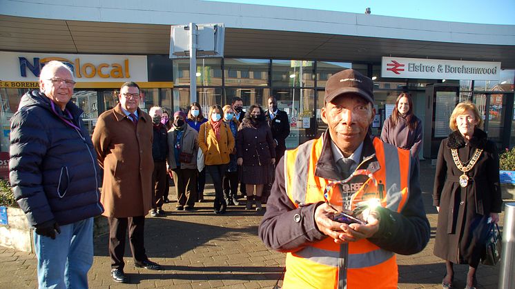 1980s pop mogul Pete Waterman (far left) joins residents of Elstree & Borehamwood to celebrate Thameslink's oldest employee, station assistant Siggy Cragwell (more images below)