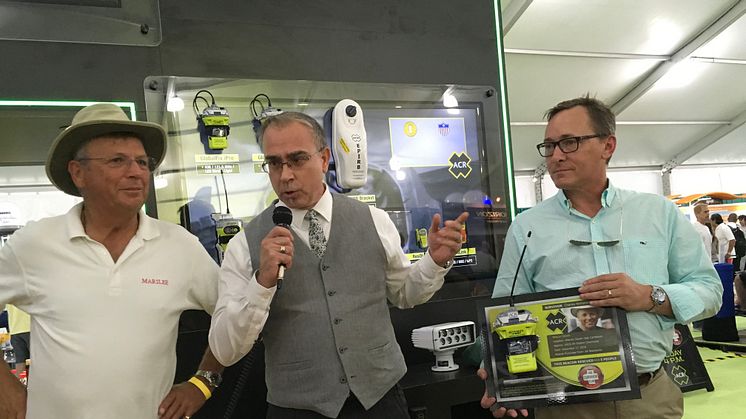 At this year’s Miami Boat Show ACR SurvivorClub member Charles Nethersole (left) shows his gratitude by presenting his used ACR EPIRB on a plaque to his U.S.C.G rescue personnel