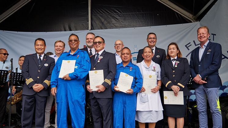 Standing from left to right: Award recipients Fitter Roberto Rebite, 1st Engineer Jose Villalobos, Oiler Victor Magbanua, Room Stewardess Carmelita Lao and Assistant Housekeeper Ruth Manaog.