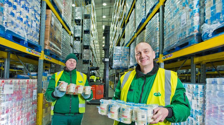 Mindaugas	Zutautas and Granville Leach, colleagues at Arla's National Distribution Centre in Leeds, surrounded by pallets of cream