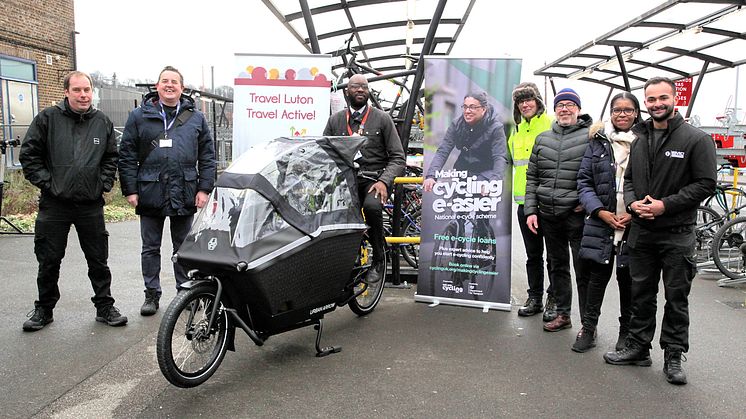 In the saddle: Thameslink station manager Hilton Matareke on bike with, from left, Ross Bartholomew (Optyma Security); Andrew Chillingsworth (Thameslink CSR mgr); Chris Wilkinson, Nathan Burge, Carol Thomas (Luton council) and Ethan Masih ('Dr Bike')
