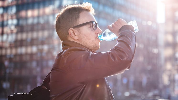 What's in your plastic bottle of water? A new study shows there could be substantial amounts of plastic particles (Credit: iStock Kerkez)