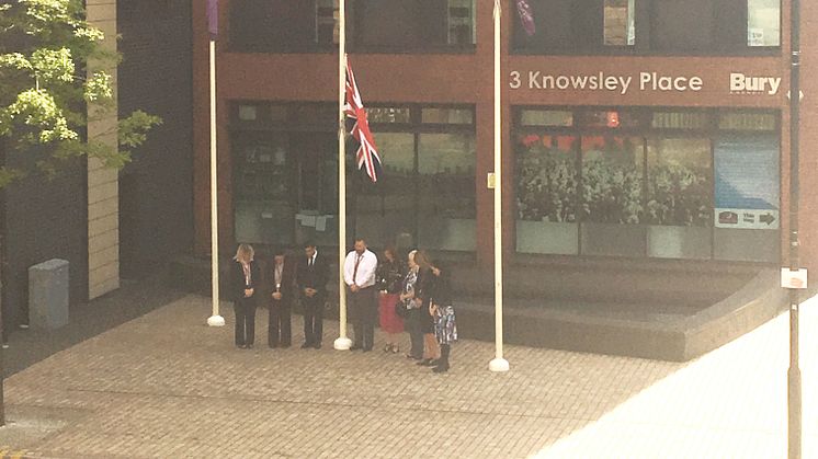 Cllr Shori and senior council colleagues show their respect this morning as the Union flag flies at half-mast