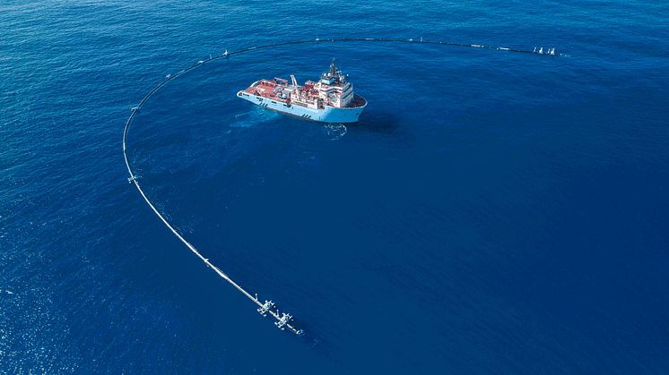 A long U-shaped pipe stretching 600 meters will capture ocean plastic waste that will end up being recycled into new products (Credit: The Ocean Cleanup)