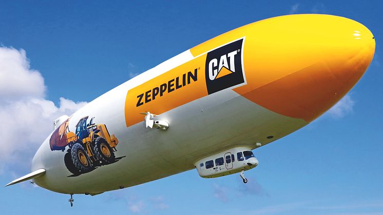 Zeppelinare med hjullastare och logotyp