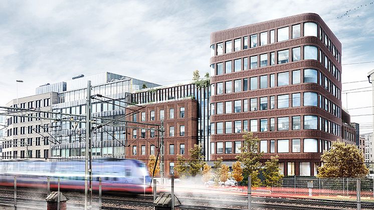 Visionsbild för hur det nya kontorshuset kommer att upplevas från järnvägssidan. Illustration: Kamikaze Arkitekter