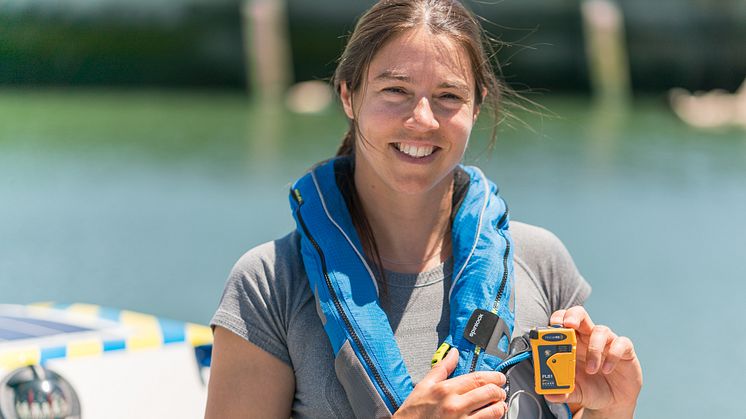 Ocean rower Lia Ditton with the Ocean Signal rescueME PLB1, one of several Ocean Signal devices she will be equipped with during her ambitious North Pacific solo crossing attempt. Photo credit: Jenn Heflin