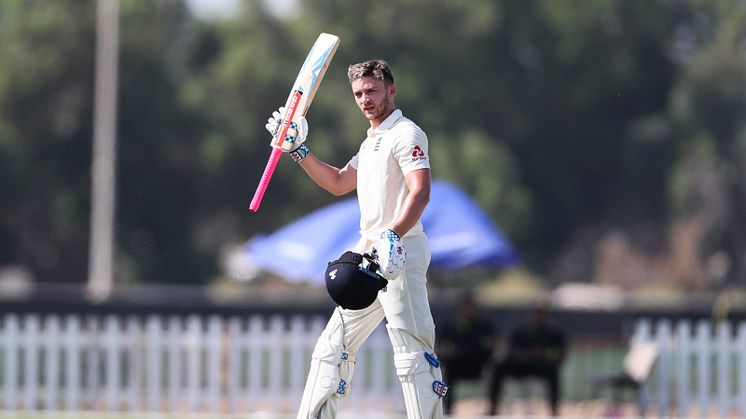 Joe Clarke celebrates his hundred. Photo: Sporta Group