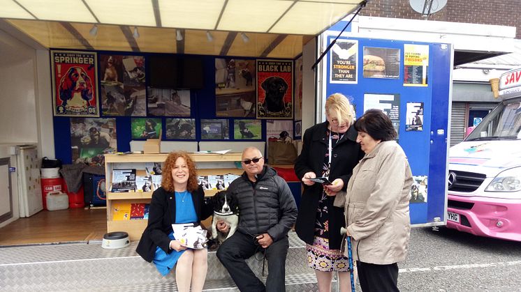 Cllr Jane Black (left) with Pippa the tobacco detection dog on Bury Market