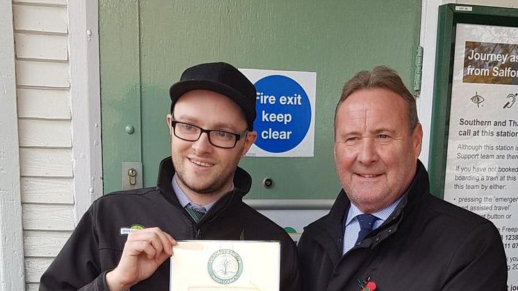 Station Assistant Andy Chantler (left) is presented with his award by parish council chairman Cllr David Brown 