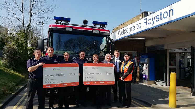 Great Northern's Station Assistant Kimberley Bekirefendieva (far right) and Local Development Manager Patrick Ladbury (second from right) present £750 to Royston community representatives and firefighters