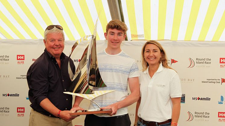 From left: Sir Keith Mills, Chairman of the Royal Foundation and Founding Director of Land Rover Ben Ainslie Racing, Harvey Attrill, winner of the Raymarine Young Sailor Trophy and Cloudy Bay’s Senior Brand Manager, Maria Ines Pina.