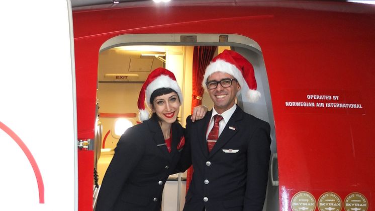 Norwegian crew welcome passengers on board 