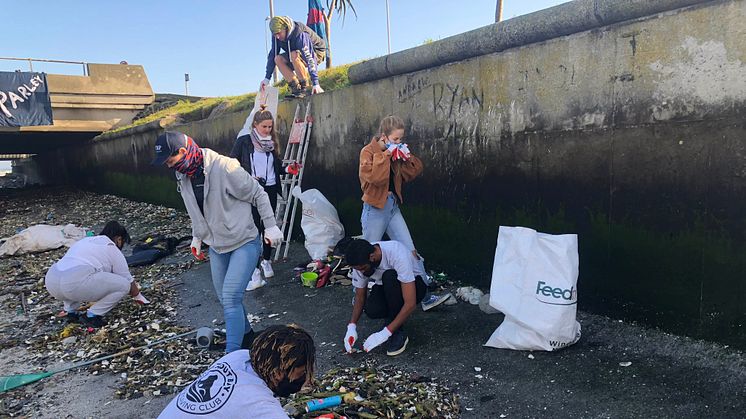 Due to Covid-19, plastic refuse now seriously litters the shoreline of Cape Town's Black River as it enters the Atlantic Ocean
