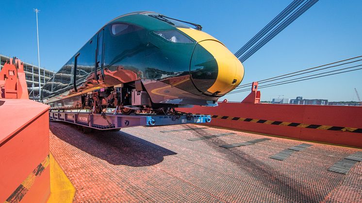 A five car train being offloaded at Southampton port 