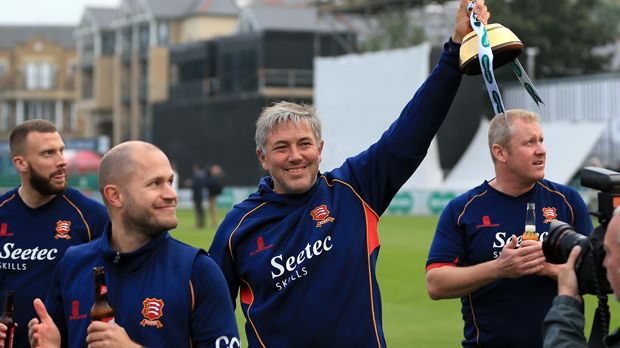 Essex Head Coach Chris Silverwood lifting the Specsavers County Championship trophy 2017