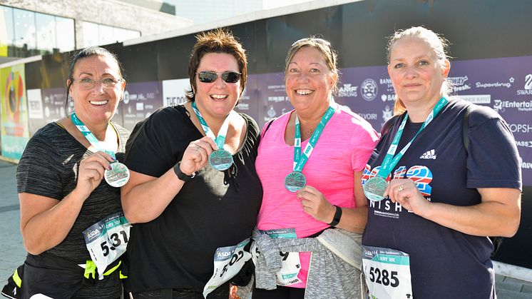 Receiving their medals following the 2016 run were (from left) Pat Jones-Greenhalgh, Delysia Hawley, Janet Spelzini and Lorraine Farr.