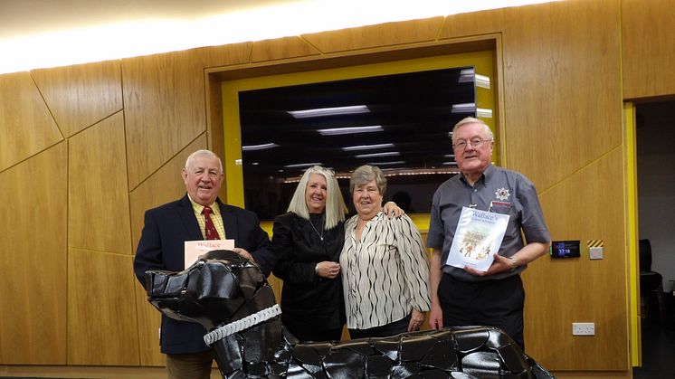 Members of the SFRS Heritage Group with Evelyn Gibson (centre left) and Jean Dallas (centre right) with the Wallace the Fire Dog sculpture.