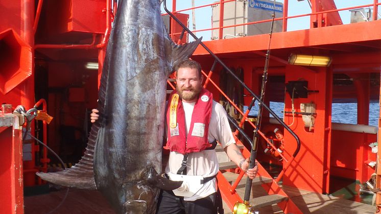 3.38 metres of blue marlin and a somewhat shorter – but proud – angler, Mikkel Hansen, onboard the ’Esvagt Connector’.