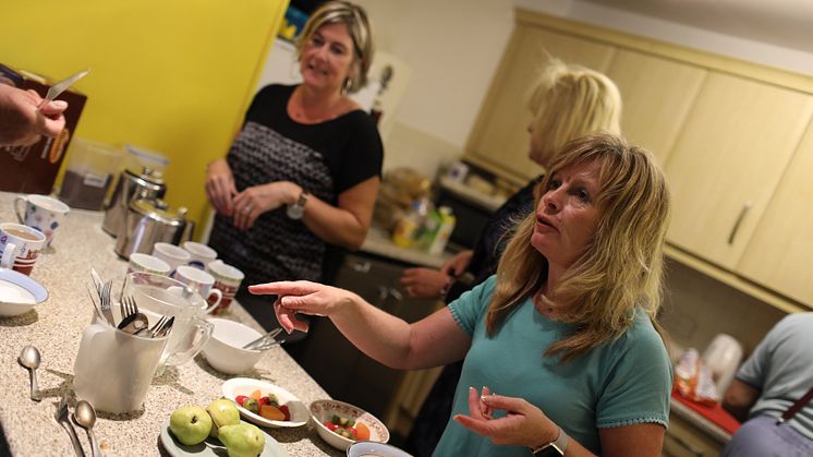 Routes to Roots volunteers helping in the kitchen at a Skinner Street drop-in session