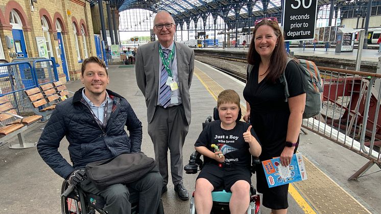 Just a boy who loves trains: 13-year-old Ryan Horrod has been given the confidence to continue travelling by train. Pictured (from left) GTR Accessibility Lead Carl Martin, Brighton's Area Station Manager Graham Thrower, Ryan and his mum, Anne
