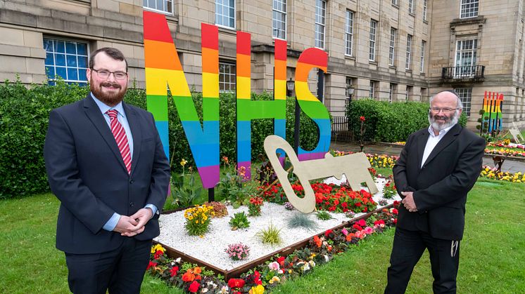 Cllr Eamonn O’Brien and Dr Jeff Schryer outside the NHS/key worker tribute at Bury Town Hall.