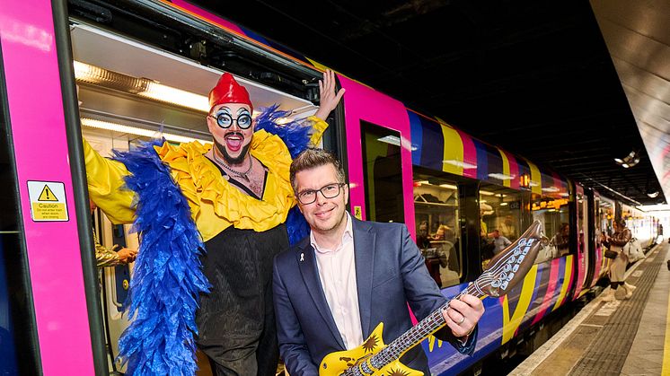 Drag queen Fatt Butcher with LNR customer experience director Jonny Wiseman and the Eurovision train