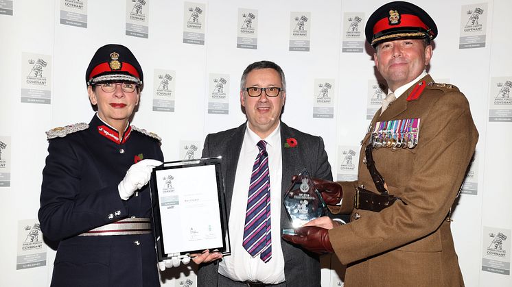Cllr Richard Gold (centre) is presented with the Silver award by Diane Hawkins, the Lord Lieutenant of Greater Manchester, and Colonel Darren Doherty, Commander Army HQ North West.