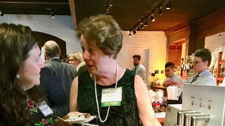 Nancy Stoner, Potomac River Keeper President, tries a glass of Bluewater contaminant free purified water.