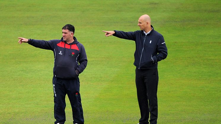 Alex Wharf, who has been appointed to the Emirates International Panel of ICC Umpires, pictured with Emirates Old Trafford groundsman Matt Merchant in September