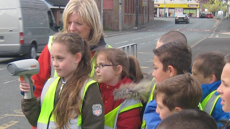 Pupils at Radcliffe Hall CE Methodist Primary School measure the speed of local traffic with Jan Brabin, the council’s senior road safety officer.