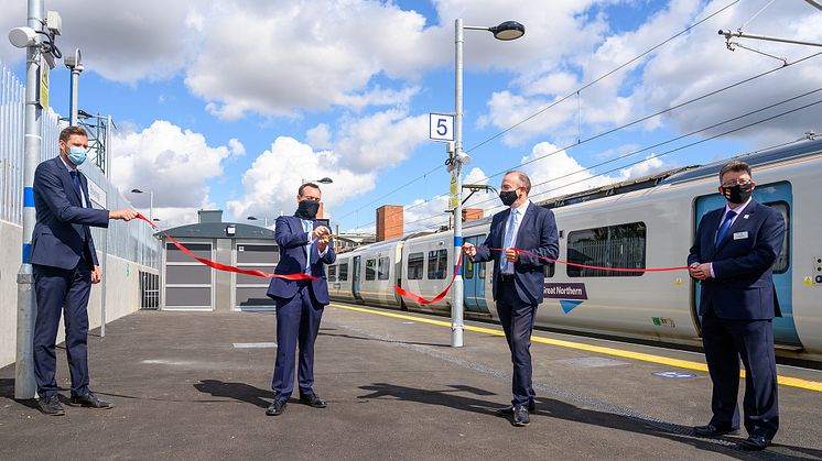 Stevenage MP Stephen McPartland cuts the ribbon with (l to r) Ed Akers, Principal Programme Sponsor, Network Rail; Chris Heaton-Harris MP,  Rail Minister; and Steve White, Chief Operating Officer, GTR