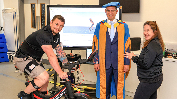 Jon Dutton is given a cycle training system demonstration by Northumbria staff