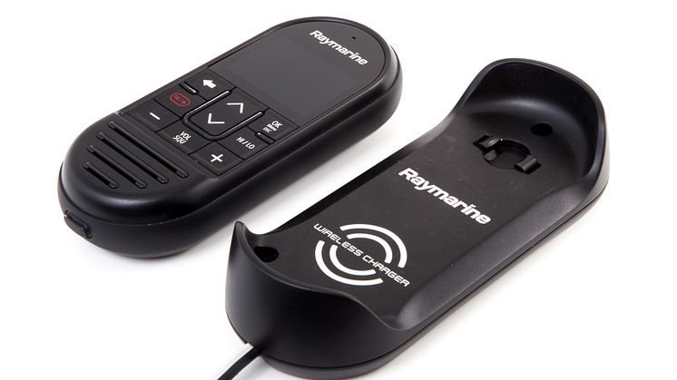 High res image - Raymarine - Wireless handset beside charger